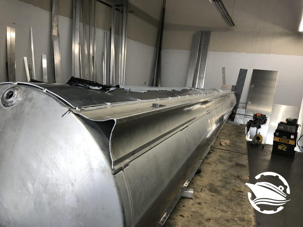 A damaged pontoon tube that came into our shop as part of an insurance repair.